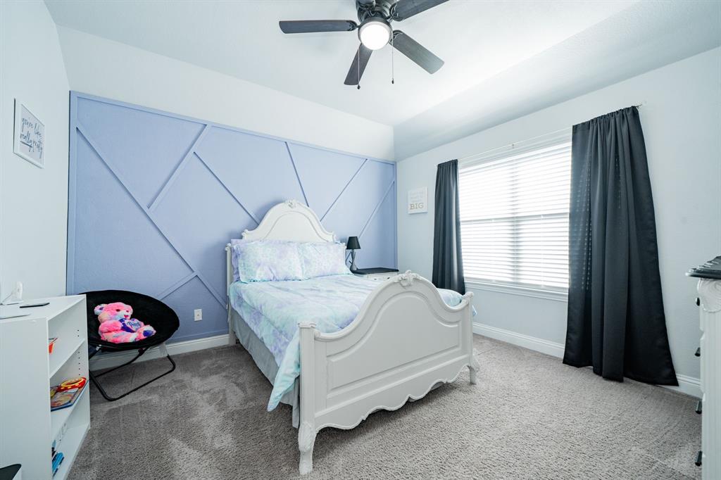 593 Spruce Trail Forney, TX 75126 - Photo 36 of 40 Bedroom featuring carpet and a ceiling fan