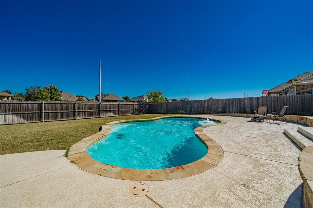 593 Spruce Trail Forney, TX 75126 - Photo 39 of 40 View of swimming pool with a fenced backyard, a patio area, and an outdoor fire pit