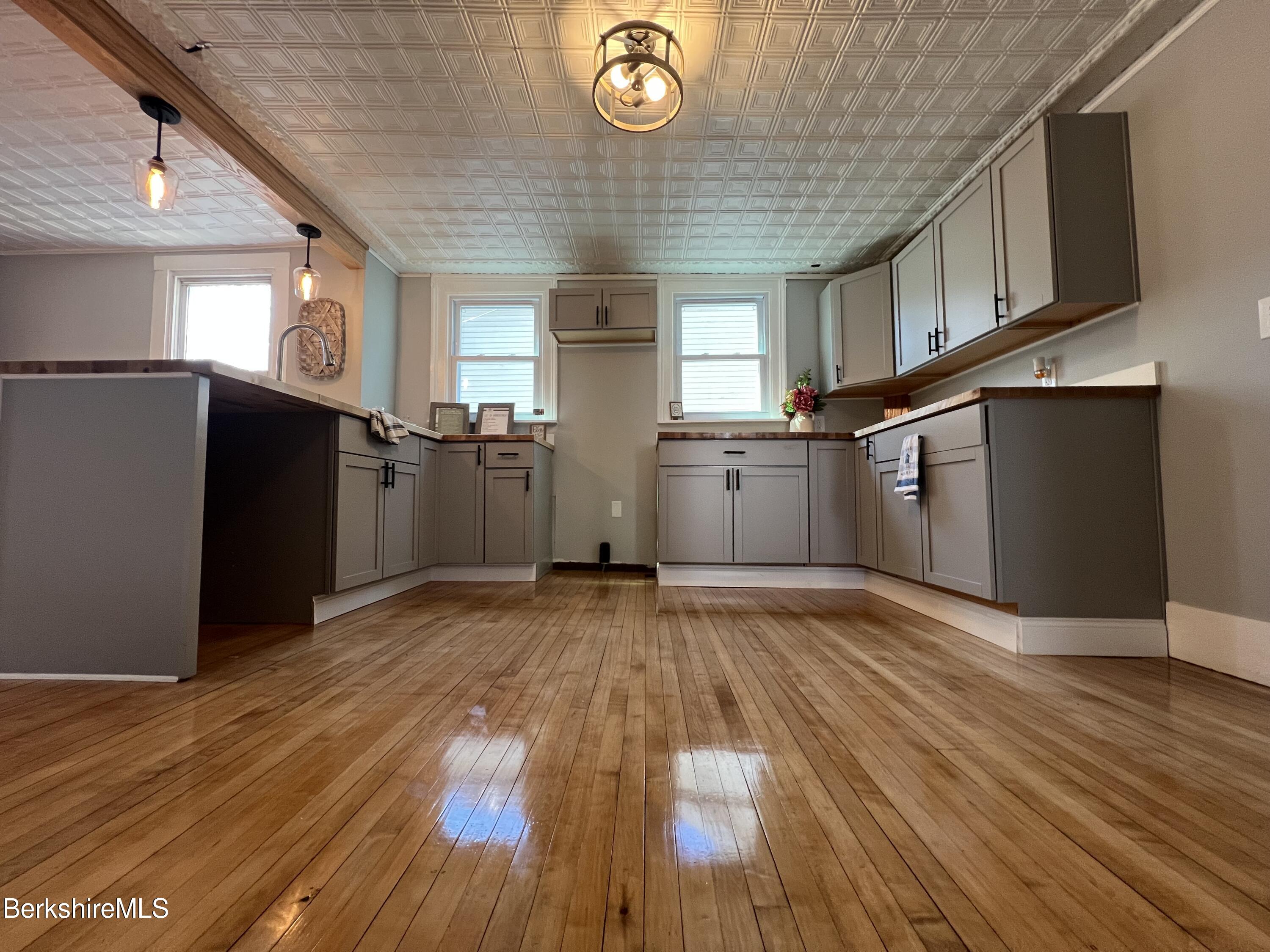 71 Howard Street Pittsfield, MA 01201 - Photo 13 of 42 a view of empty room with wooden floor