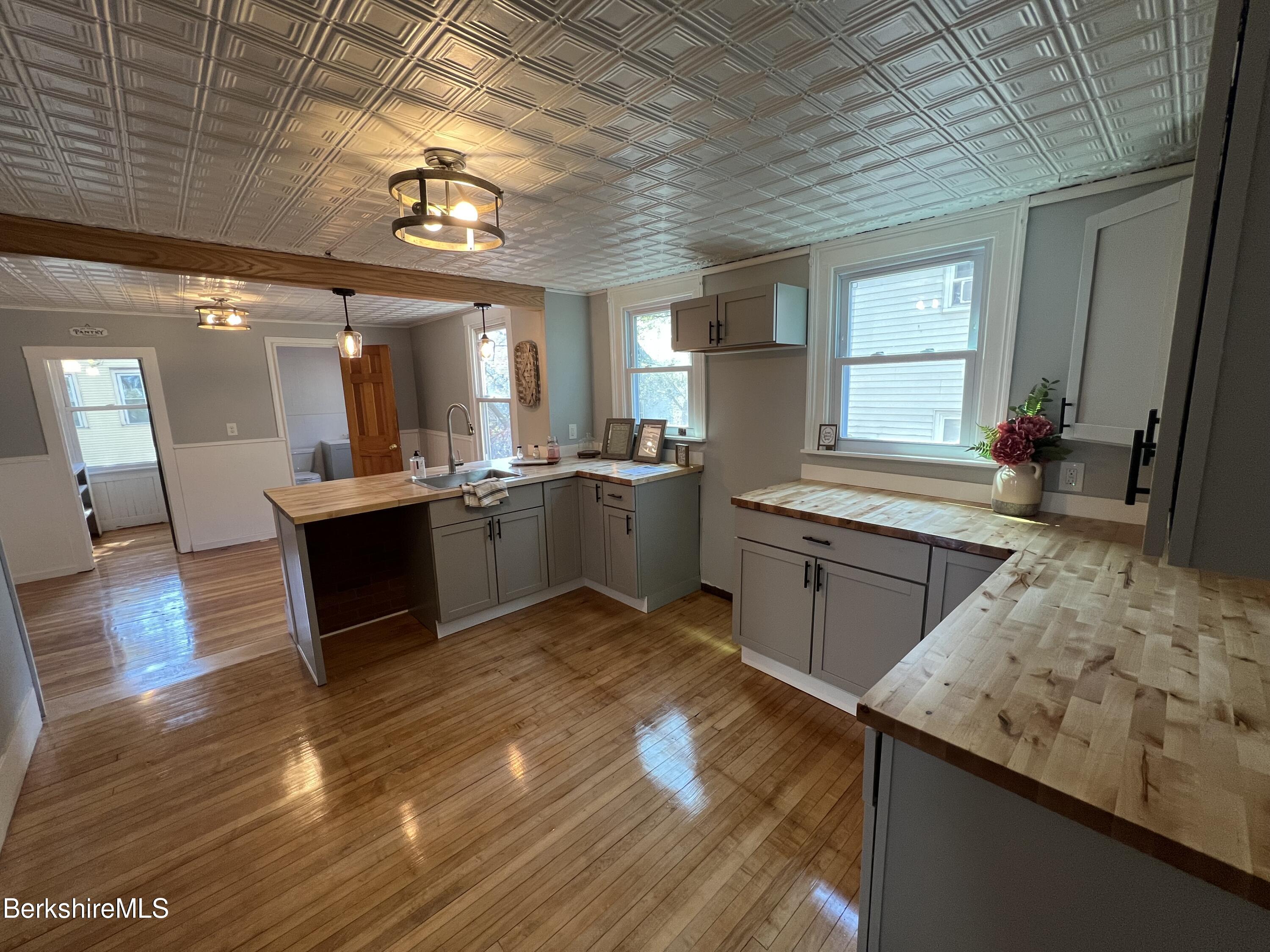 71 Howard Street Pittsfield, MA 01201 - Photo 14 of 42 a large kitchen with a lot of counter space