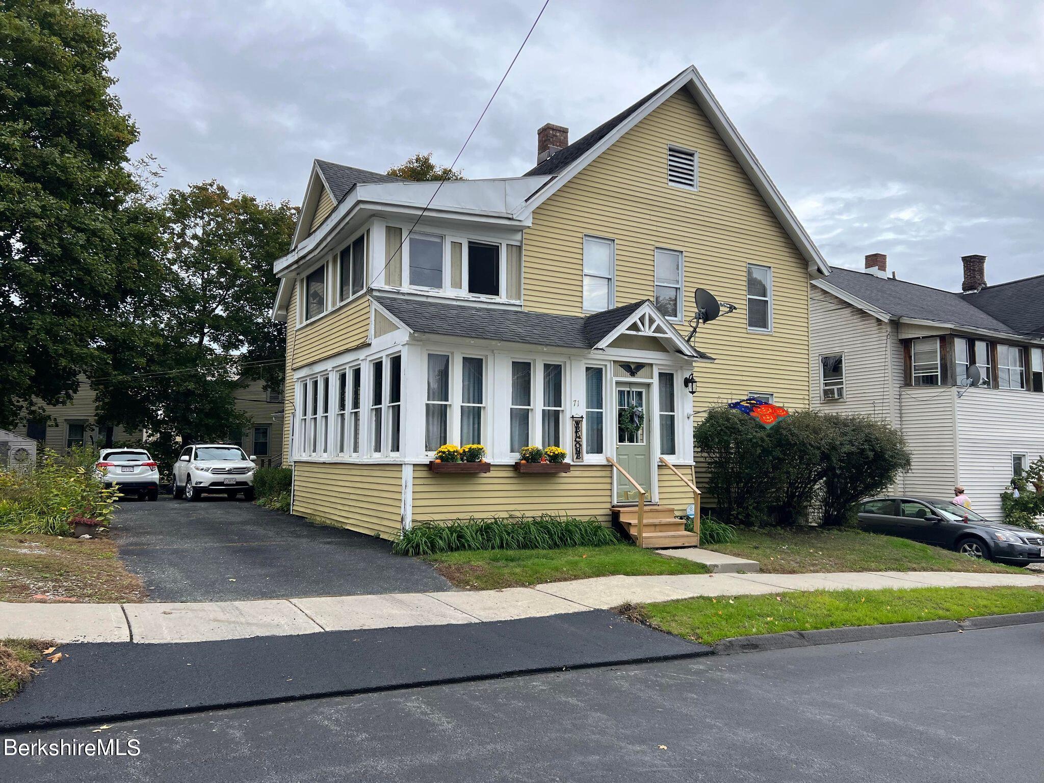 71 Howard Street Pittsfield, MA 01201 - Photo 2 of 42 a front view of a house with a yard