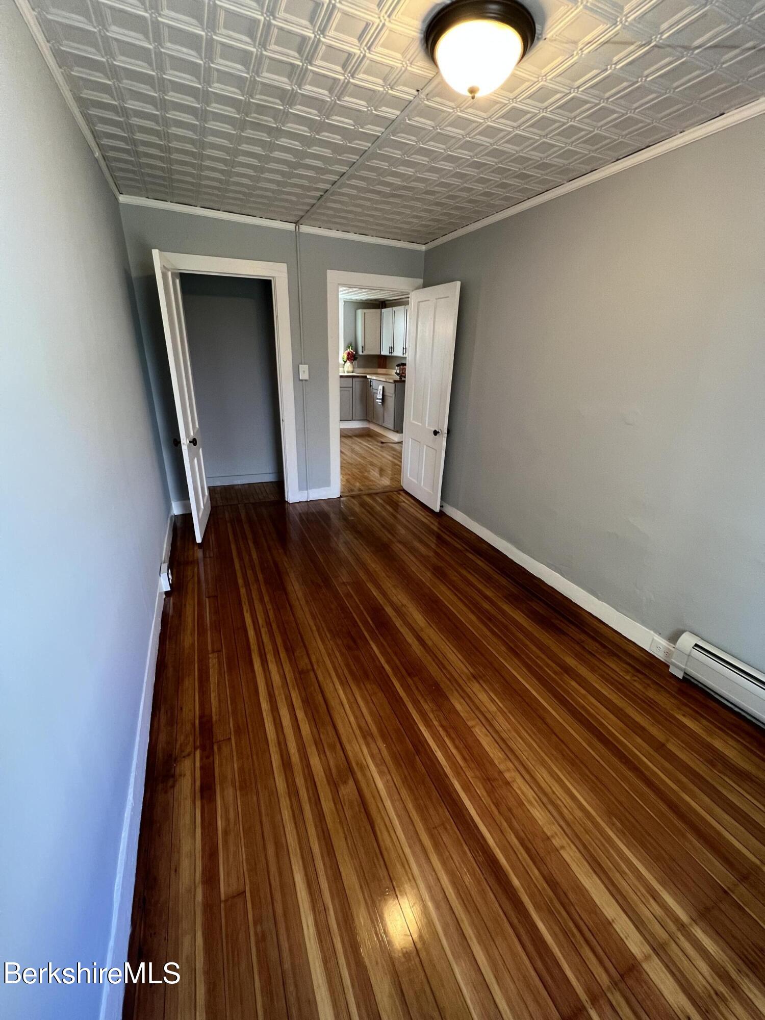 71 Howard Street Pittsfield, MA 01201 - Photo 22 of 42 a view of empty room with wooden floor
