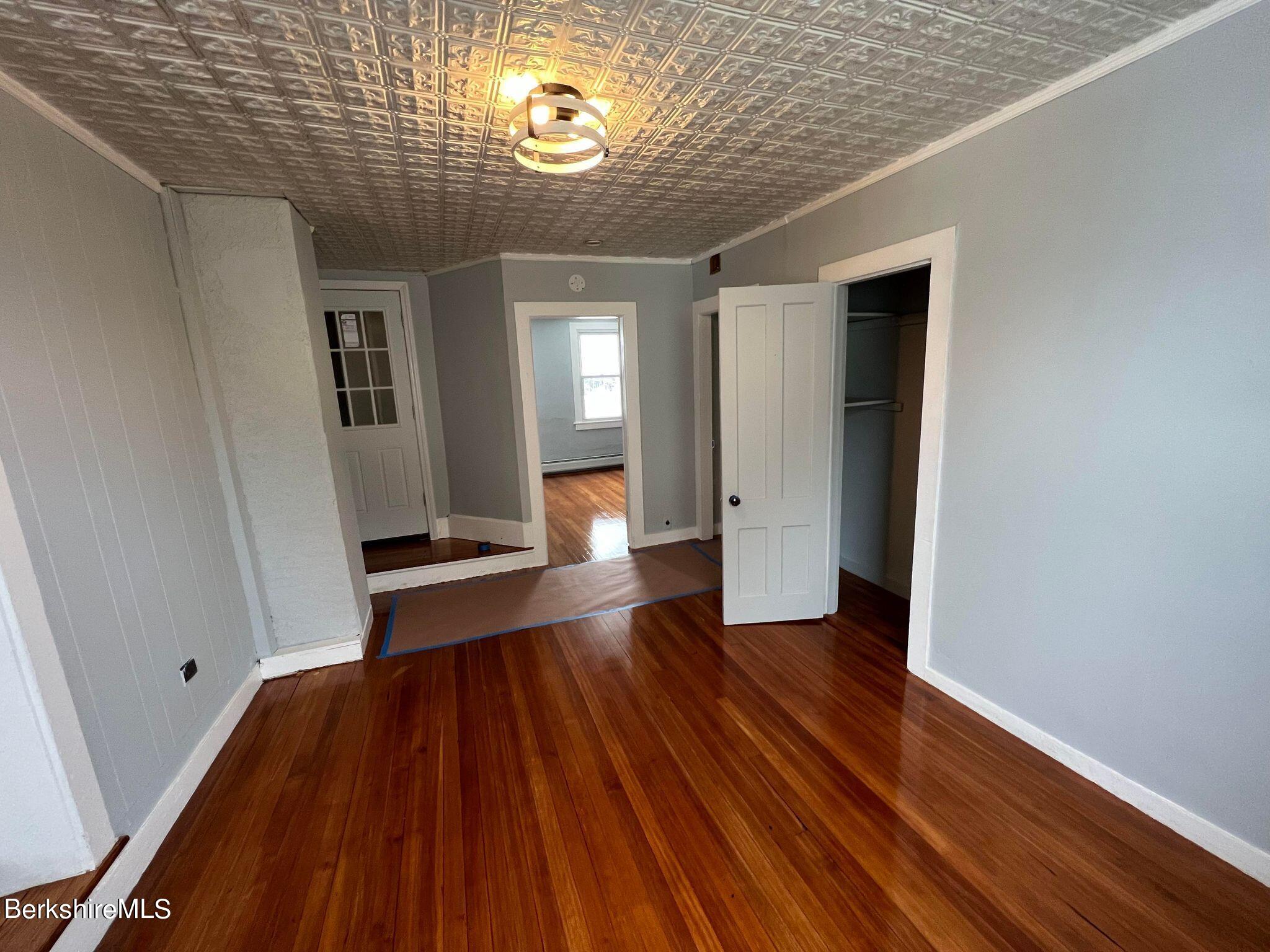 71 Howard Street Pittsfield, MA 01201 - Photo 31 of 42 a view of a hallway with wooden floor