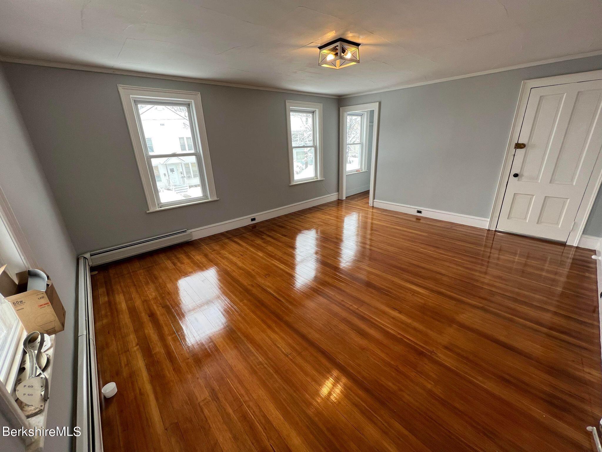 71 Howard Street Pittsfield, MA 01201 - Photo 33 of 42 wooden floor in an empty room with a window
