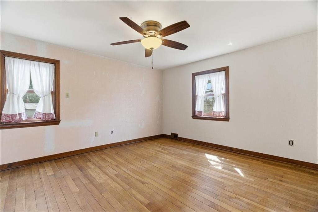 30 Warriors Road Pittsburgh, PA 15220 - Photo 11 of 30 a view of an empty room with wooden floor and a window