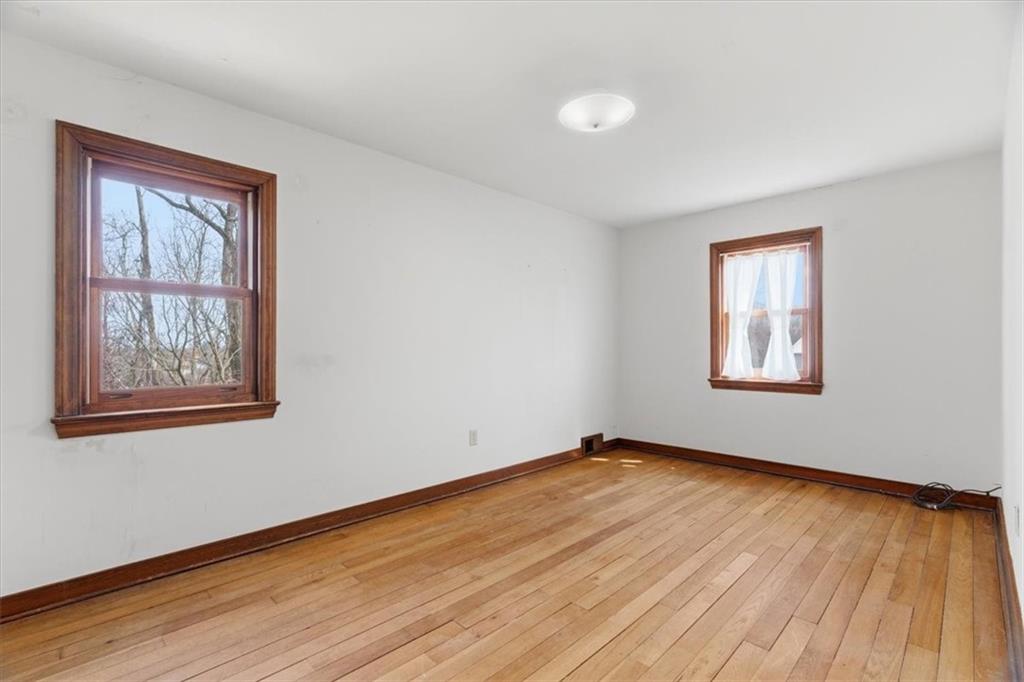 30 Warriors Road Pittsburgh, PA 15220 - Photo 13 of 30 a view of an empty room with wooden floor and a window