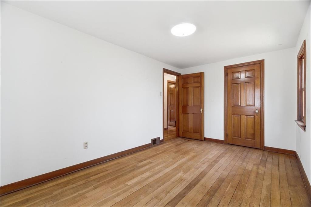 30 Warriors Road Pittsburgh, PA 15220 - Photo 14 of 30 an empty room with wooden floor and windows