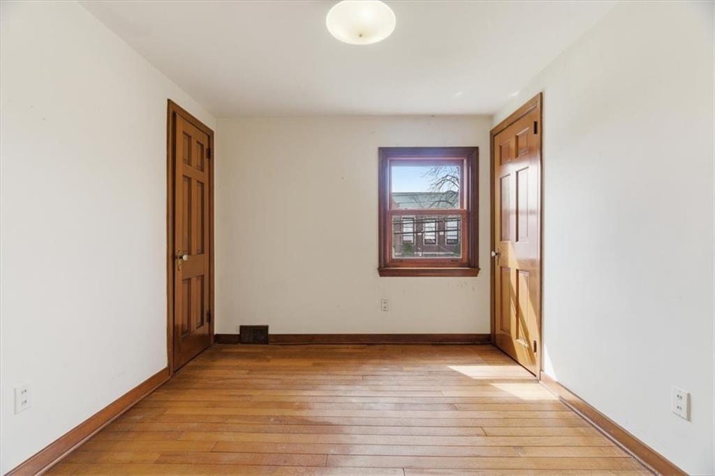 30 Warriors Road Pittsburgh, PA 15220 - Photo 15 of 30 an empty room with wooden floor and windows