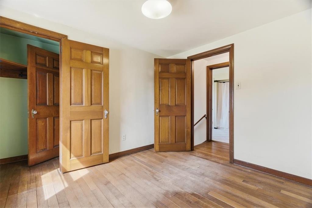 30 Warriors Road Pittsburgh, PA 15220 - Photo 16 of 30 an empty room with wooden floor and windows