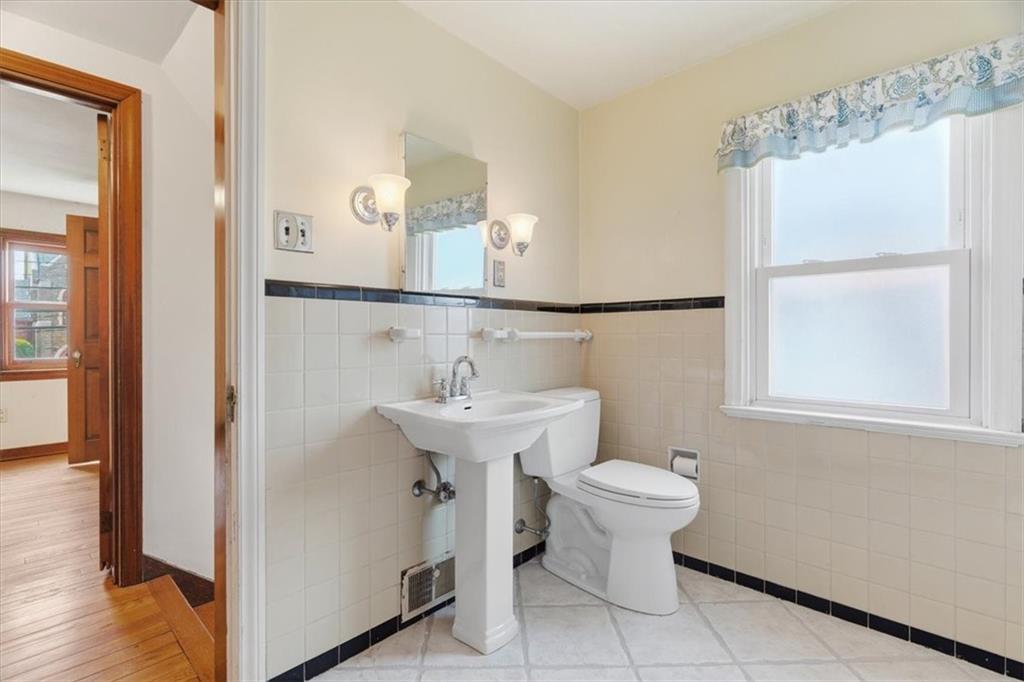 30 Warriors Road Pittsburgh, PA 15220 - Photo 19 of 30 a bathroom with a sink toilet and a mirror