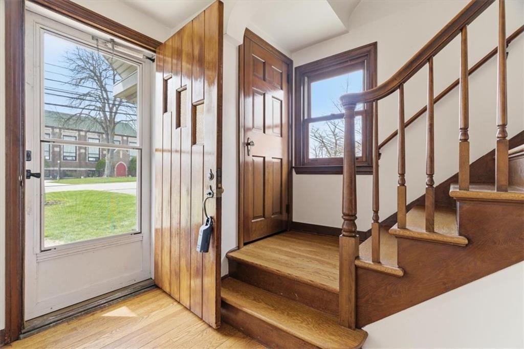 30 Warriors Road Pittsburgh, PA 15220 - Photo 2 of 30 a view of an entryway with wooden floor and door