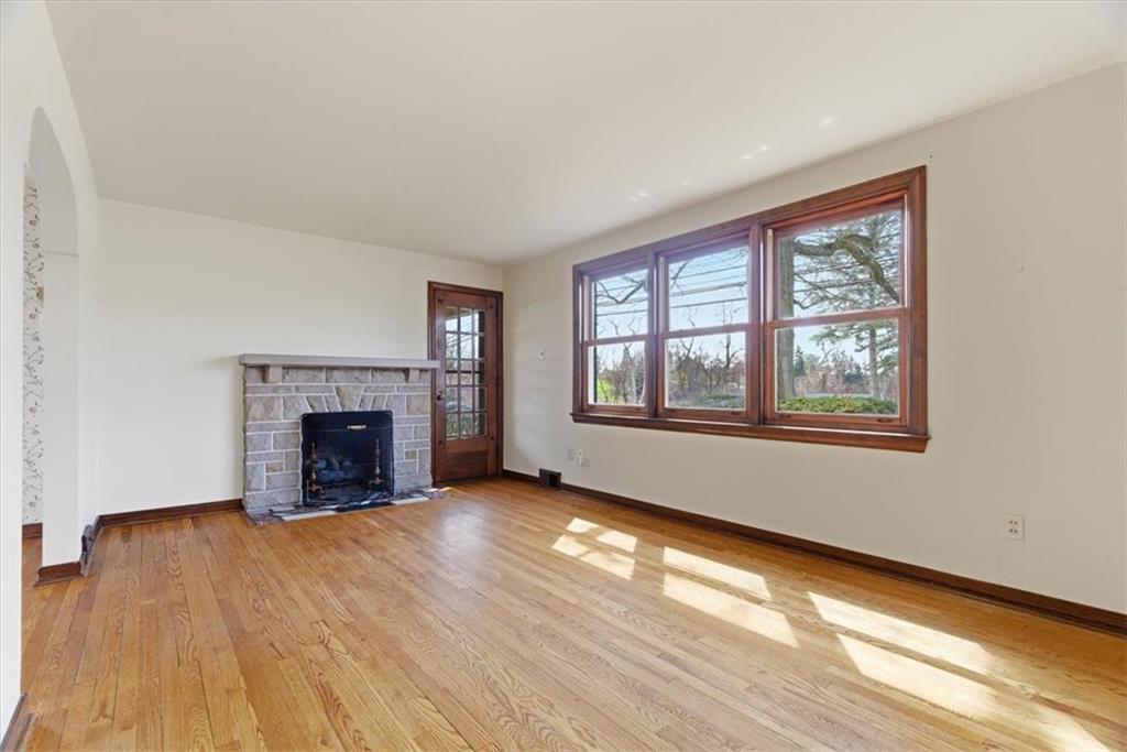 30 Warriors Road Pittsburgh, PA 15220 - Photo 4 of 30 a view of an empty room with wooden floor and a window