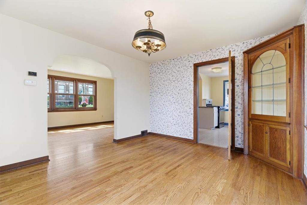 30 Warriors Road Pittsburgh, PA 15220 - Photo 7 of 30 wooden floor in an empty room with a window