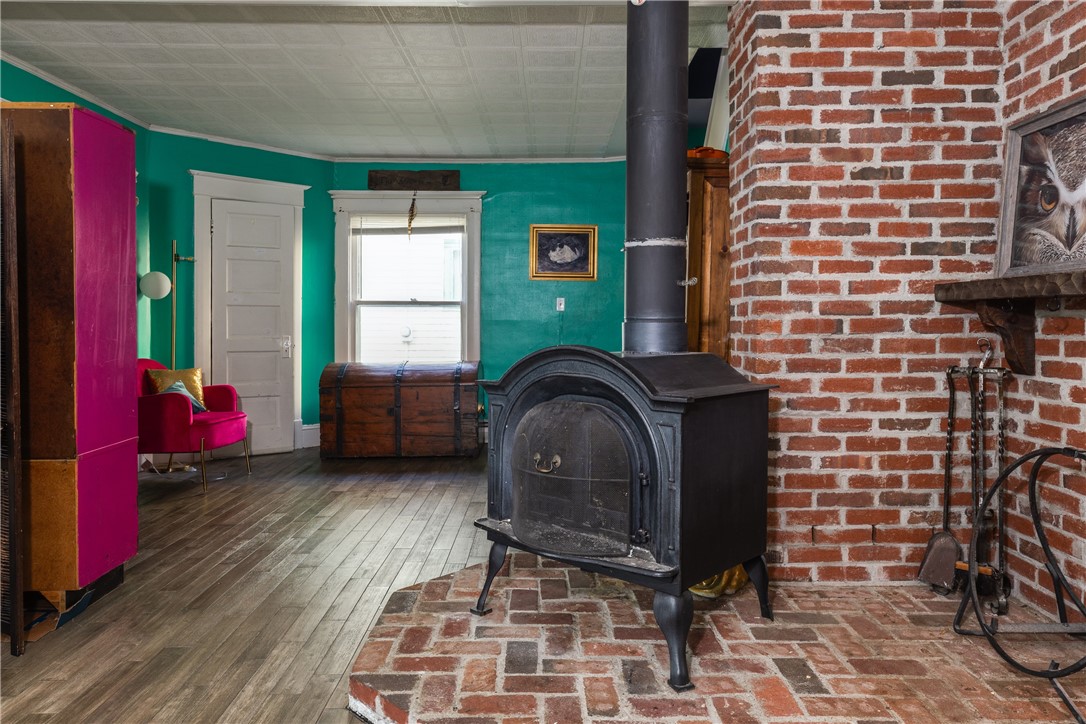 14 Elm Street Corning, NY 14830 - Photo 7 of 39 Living room with coal stove