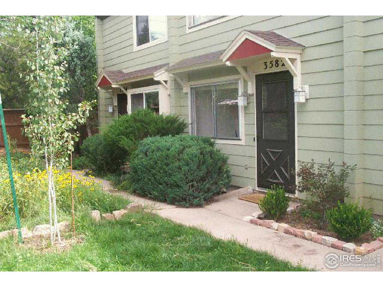 3582 Broadway Boulder, CO 80304 - Photo 2 of 6 a front view of house with yard