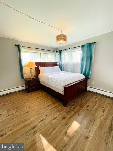 a living room with a bed and a table