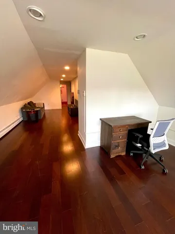 a bedroom with a bed and a rug