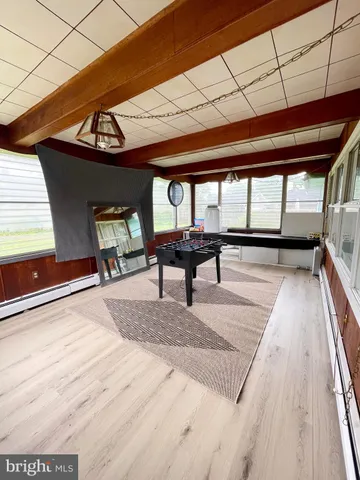 a view of a chairs and table in the balcony