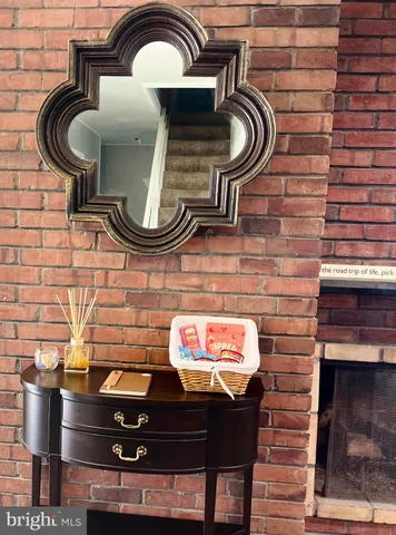 a room with pool table and windows