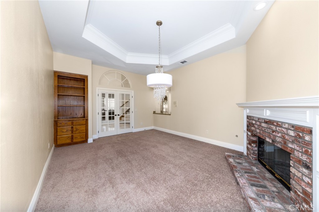 7007 Golden Vale Drive Riverside, CA 92506 - Photo 28 of 72 a view of a livingroom with a fireplace and window