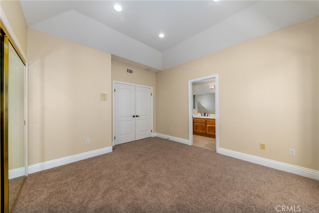 7007 Golden Vale Drive Riverside, CA 92506 - Photo 32 of 72 an empty room with an entrance to other room