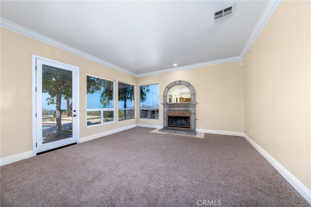 7007 Golden Vale Drive Riverside, CA 92506 - Photo 36 of 72 a view of empty room with wooden floor and fan