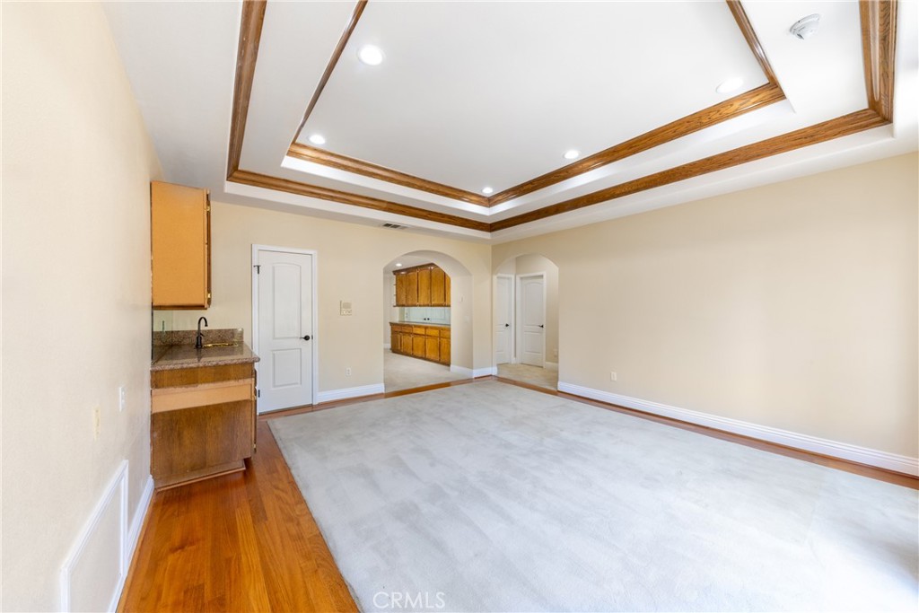 7007 Golden Vale Drive Riverside, CA 92506 - Photo 49 of 72 a view of a hallway with wooden floor