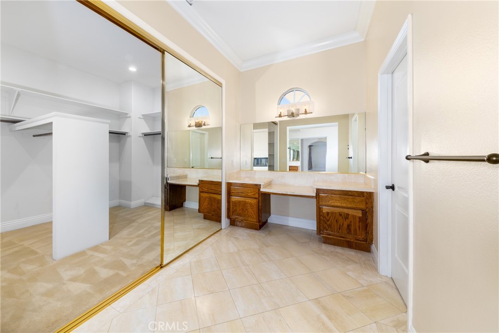 7007 Golden Vale Drive Riverside, CA 92506 - Photo 63 of 72 a large bedroom with a large bed and a view of bathroom