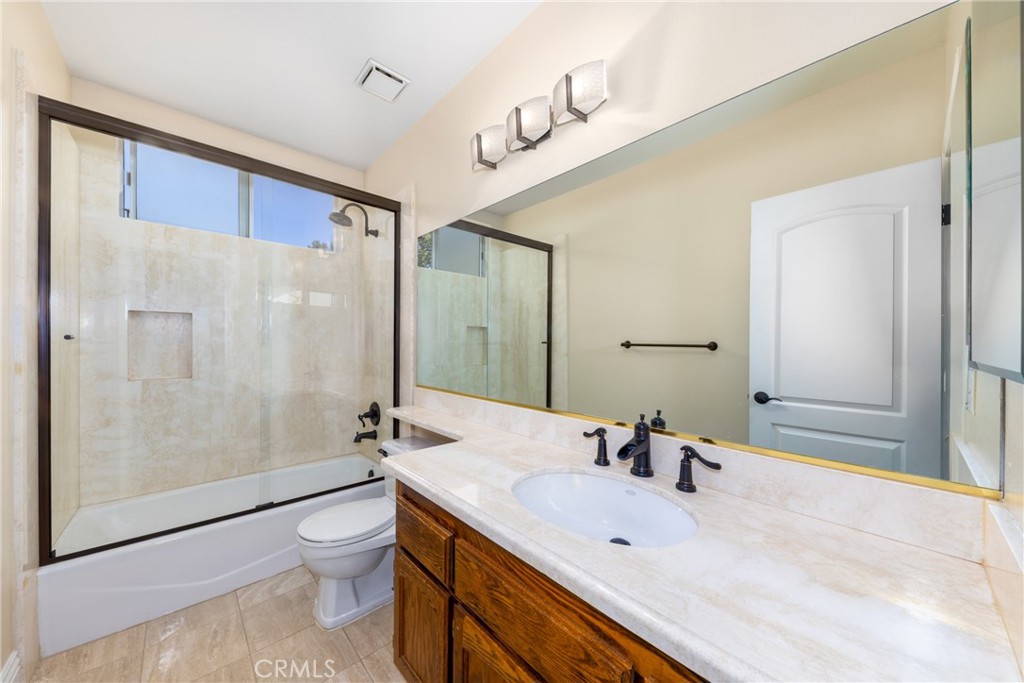 7007 Golden Vale Drive Riverside, CA 92506 - Photo 67 of 72 a bathroom with a sink a toilet and shower