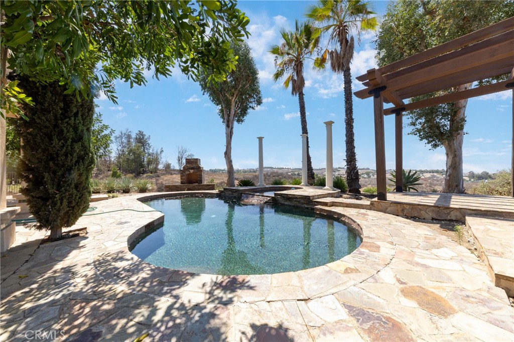 7007 Golden Vale Drive Riverside, CA 92506 - Photo 69 of 72 a view of a swimming pool with a patio