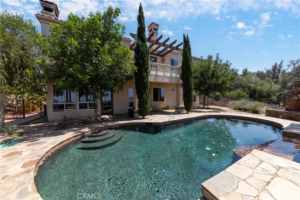 7007 Golden Vale Drive Riverside, CA 92506 - Photo 71 of 72 a view of swimming pool with lawn chairs and plants