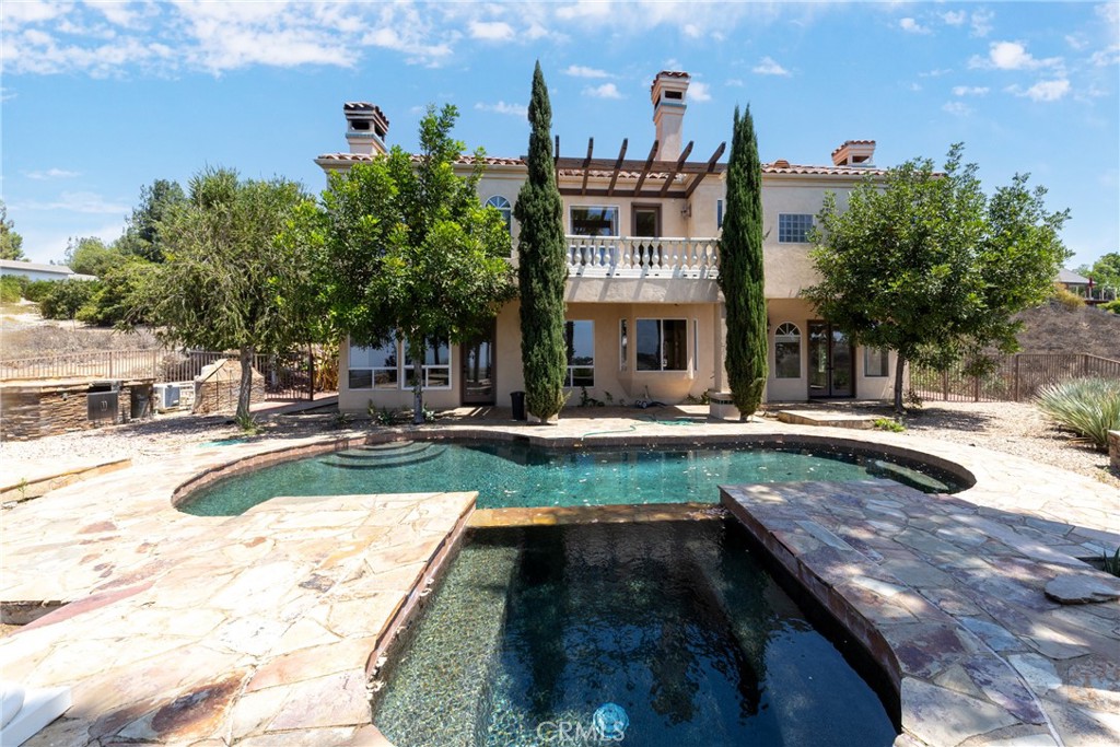 7007 Golden Vale Drive Riverside, CA 92506 - Photo 72 of 72 a view of a swimming pool with a patio
