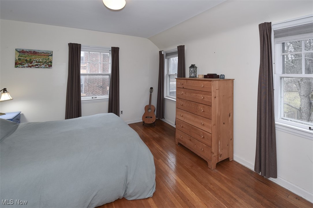 2469 Queenston Road Cleveland, OH 44118 - Photo 20 of 37 Bedroom with baseboards, lofted ceiling, and hardwood / wood-style floors