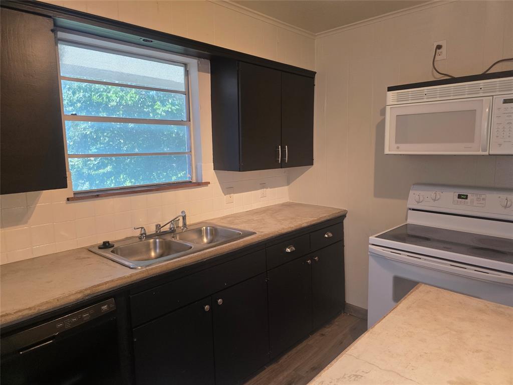 a kitchen with a sink and a window
