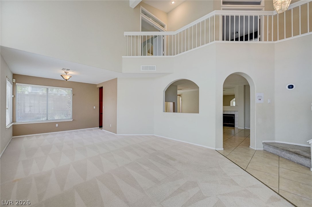 9301 Magic Flower Avenue Las Vegas, NV 89134 - Photo 69 of 70 This expansive interior features high ceilings, an open floor plan, and elegant arched doorways.