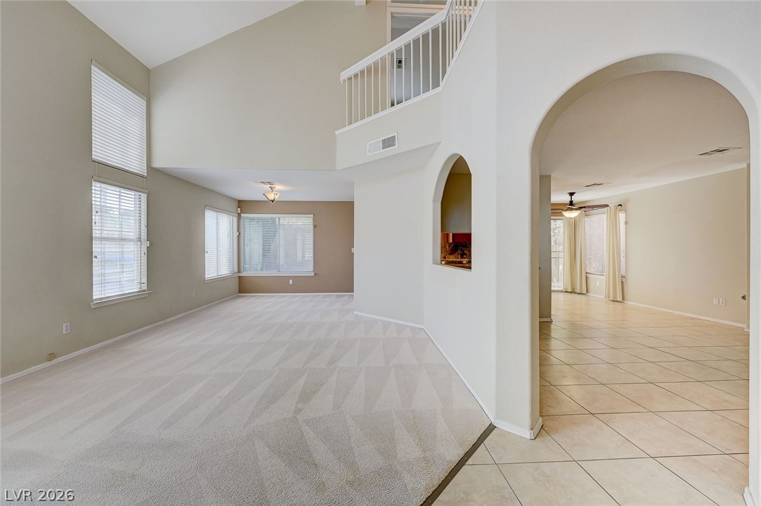9301 Magic Flower Avenue Las Vegas, NV 89134 - Photo 68 of 70 Bright, airy living space features soaring ceilings, large windows, and a versatile floorplan.