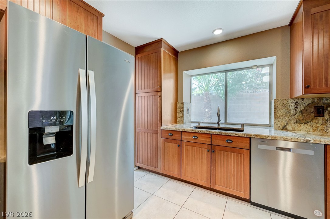 9301 Magic Flower Avenue Las Vegas, NV 89134 - Photo 33 of 70 This spacious kitchen offers ample storage, bright lighting, and beautiful counter space.