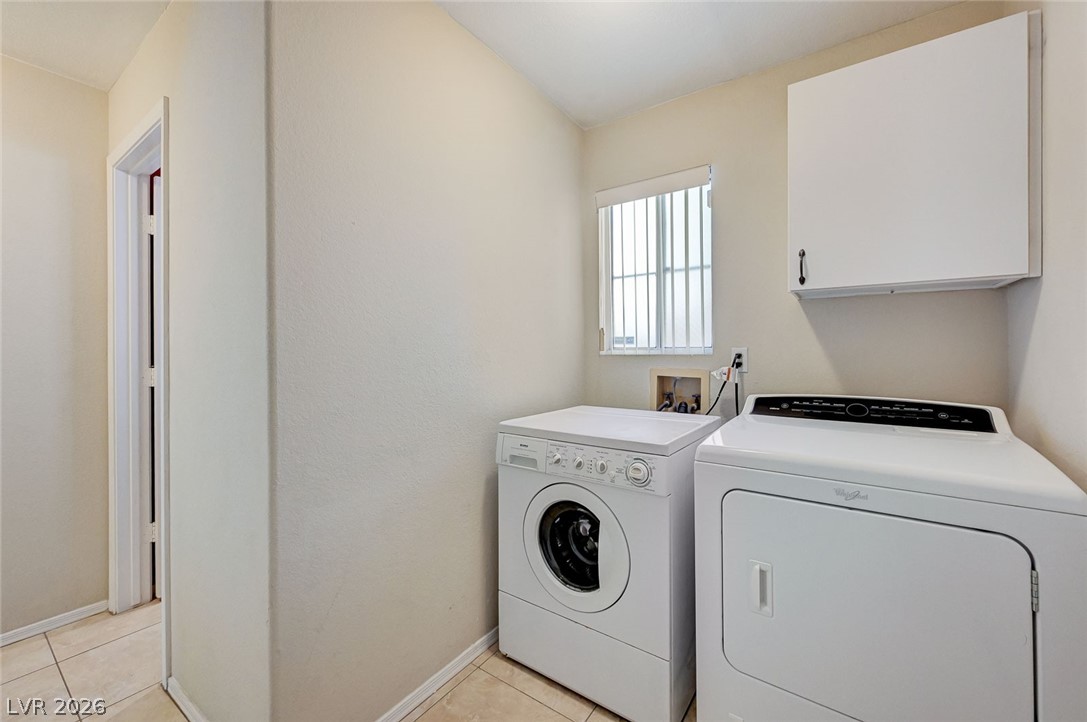 9301 Magic Flower Avenue Las Vegas, NV 89134 - Photo 36 of 70 This convenient laundry room includes all essential appliances and durable tile flooring.