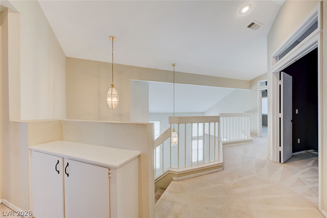 9301 Magic Flower Avenue Las Vegas, NV 89134 - Photo 37 of 70 This spacious interior offers an inviting open concept with vaulted ceilings and ample natural light.