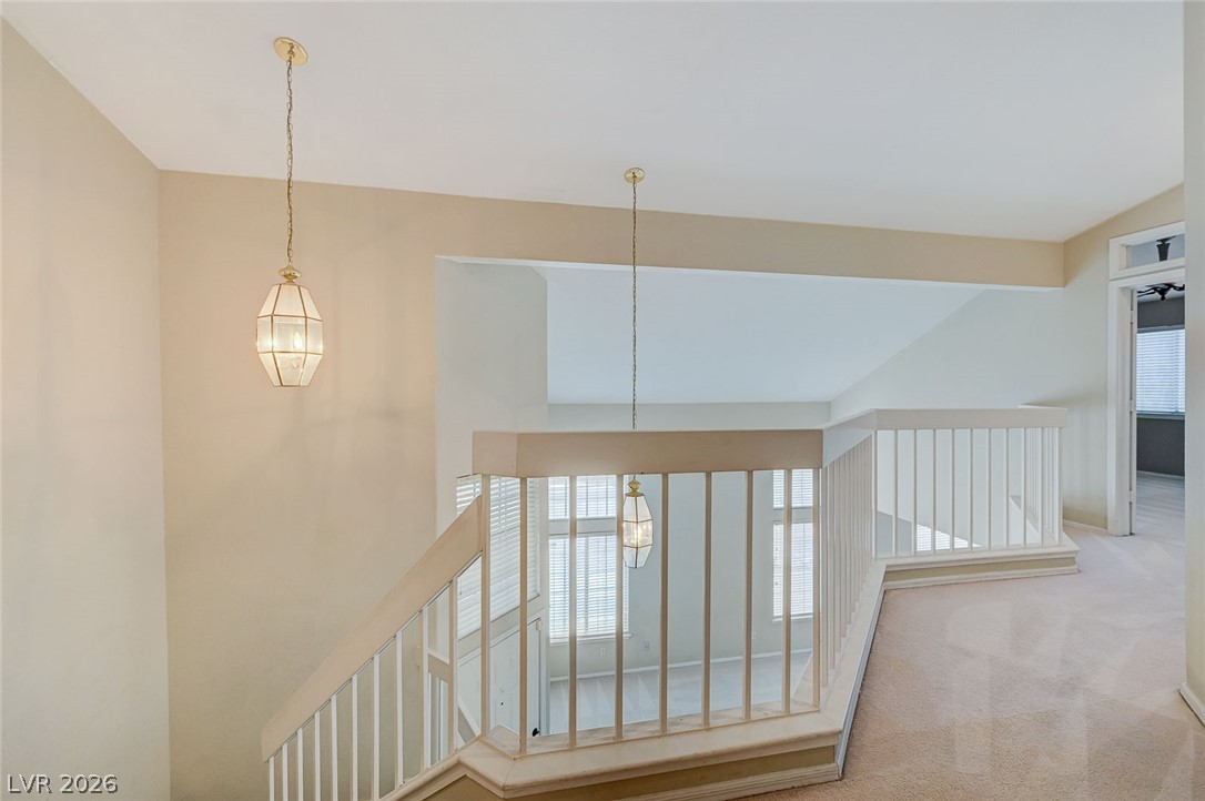 9301 Magic Flower Avenue Las Vegas, NV 89134 - Photo 70 of 70 This spacious interior features high ceilings and a welcoming open floorplan with comfortable carpet.