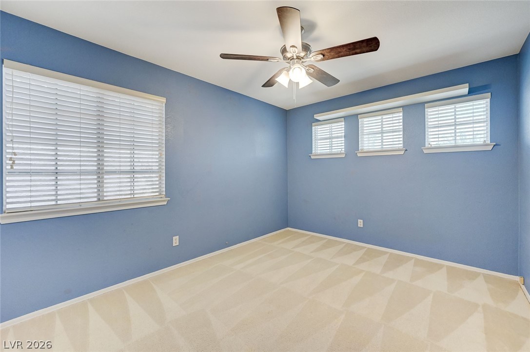 9301 Magic Flower Avenue Las Vegas, NV 89134 - Photo 55 of 70 Bright and airy, this room offers ample natural light and a comfortable atmosphere.