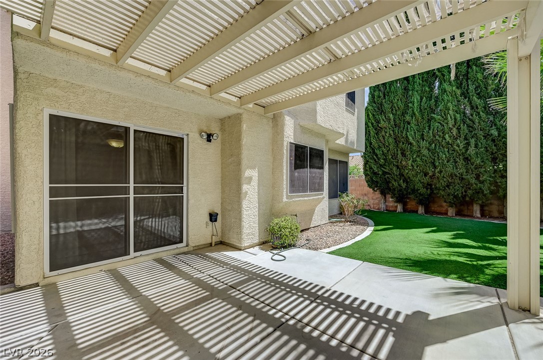 9301 Magic Flower Avenue Las Vegas, NV 89134 - Photo 61 of 70 This spacious patio area offers ample space for outdoor relaxation and entertainment.