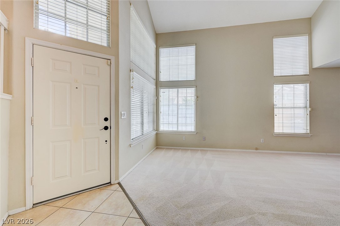 9301 Magic Flower Avenue Las Vegas, NV 89134 - Photo 8 of 70 This bright and airy living space welcomes you with soaring ceilings and abundant natural light.