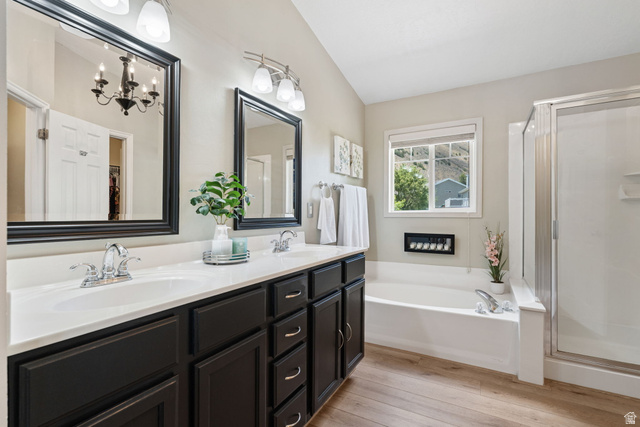 14883 Tooele Lane Draper, UT 84020 - Photo 27 of 49 Bathroom featuring a double vanity with dark cabinetry and white countertops