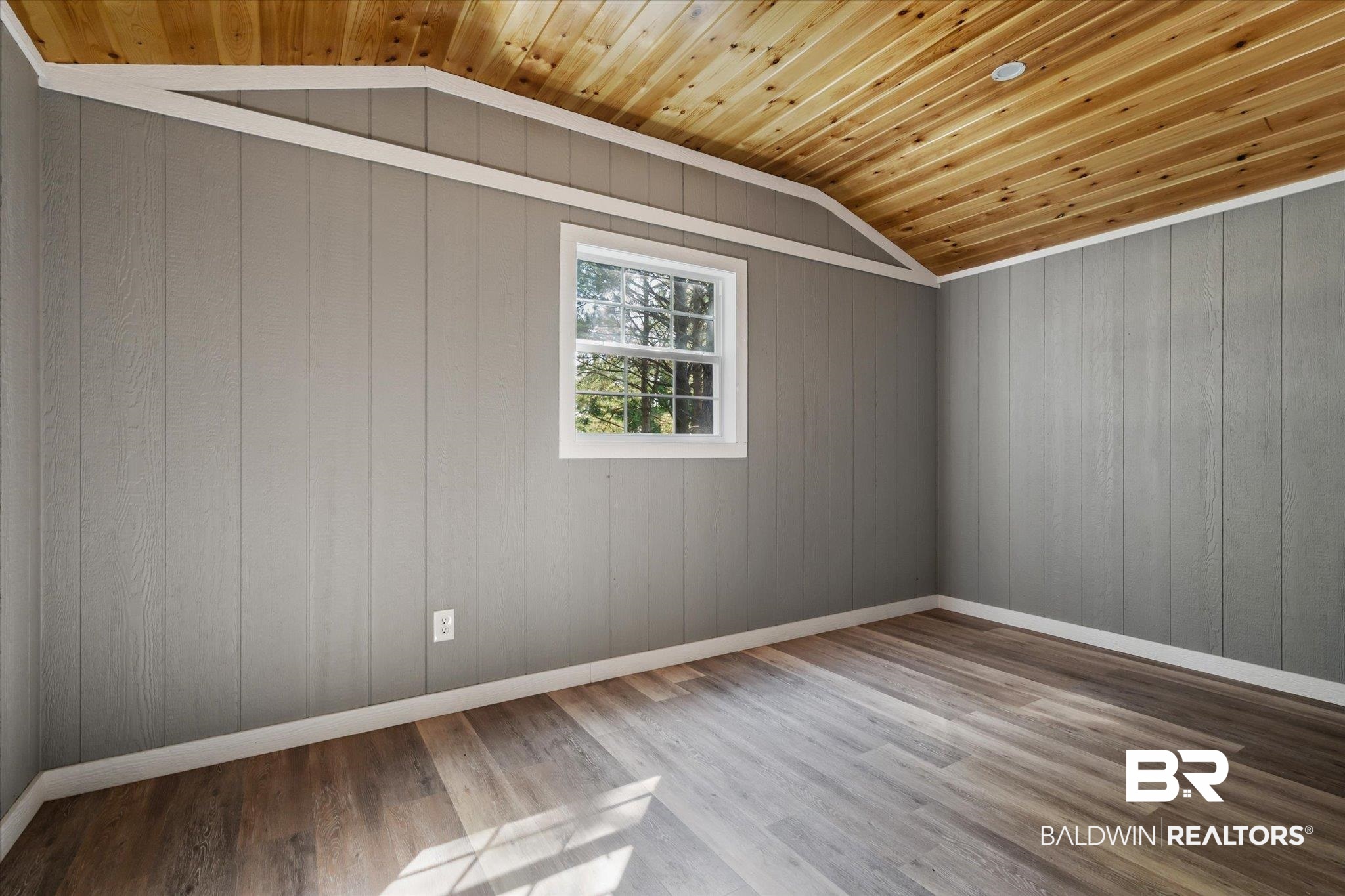 15685 Louis Cooper Road Bay Minette, AL 36507 - Photo 19 of 26 Spare room featuring wood ceiling, wooden walls, lofted ceiling, and wood-type flooring