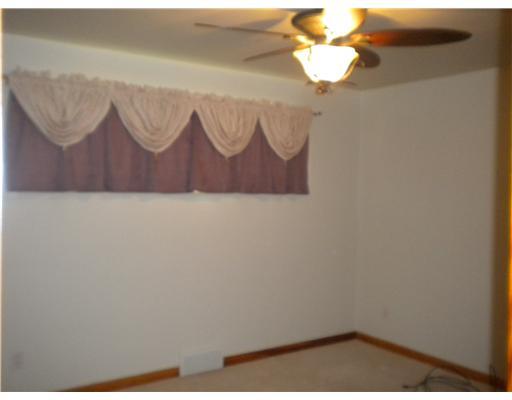 429 Friel Road Economy, PA 15005 - Photo 7 of 18 Master Bedroom. Updated lighting fixtures....Windows on both sides (covered for the shift sleeper!).....Ceiling fan