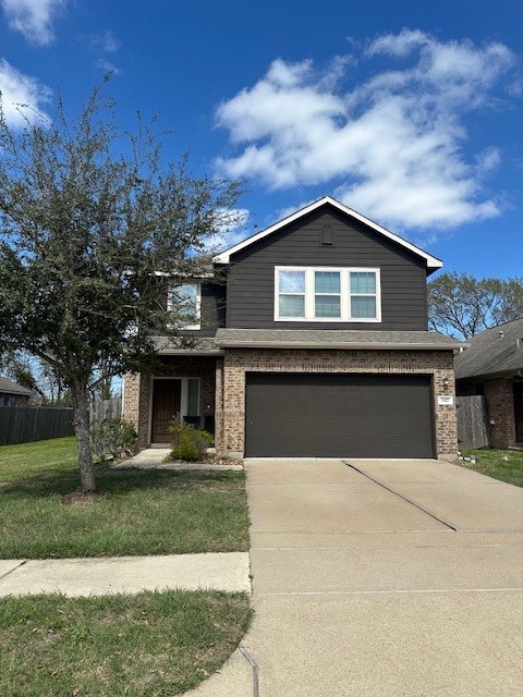 3327 Atherton Ridge Lane Houston, TX 77047 - Photo 1 of 12 a front view of a house with yard and trees