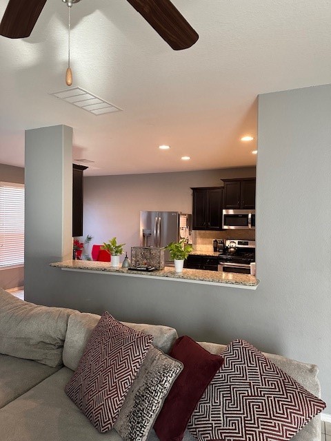 3327 Atherton Ridge Lane Houston, TX 77047 - Photo 5 of 12 a room with furniture and a flat screen tv