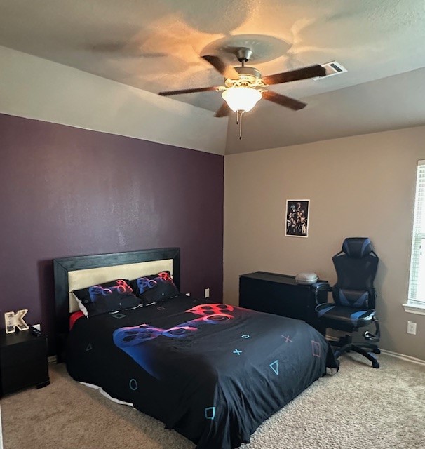 3327 Atherton Ridge Lane Houston, TX 77047 - Photo 7 of 12 a bedroom with bed and a chandelier