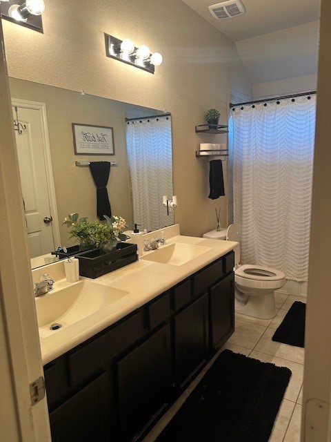 3327 Atherton Ridge Lane Houston, TX 77047 - Photo 10 of 12 a bathroom with a double vanity sink toilet and mirror